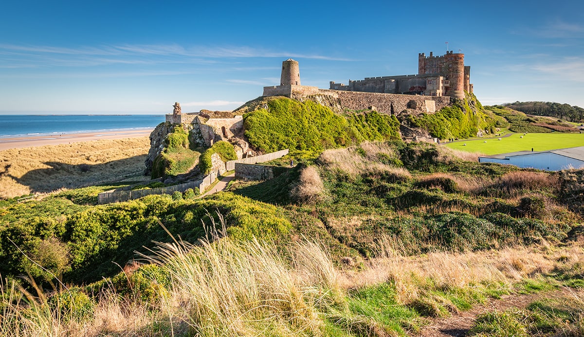 Bamburgh Castle viewed from an elevated hillock